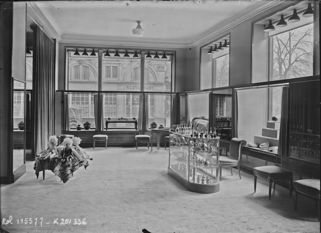 Interior of the Lanvin boutique on Champs-Elysee, taken around 1927. Picture shows on the left some dolls, and on the right cabinets with Lanvin perfumes and testers.